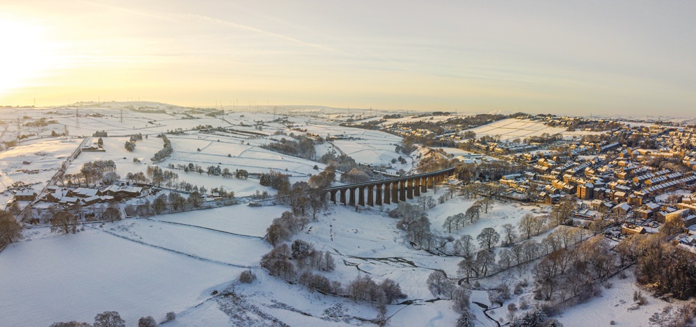 A viaduct in a snowy upland landscape