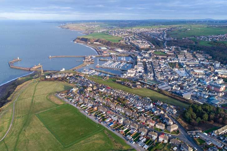 An aerial view of a harbour and small town