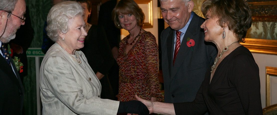 The Queen shaking hands with Prunella Scales
