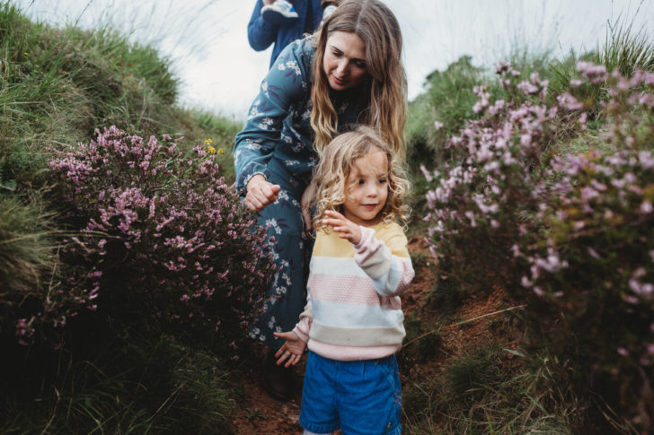 Mum and daughter walking through heather