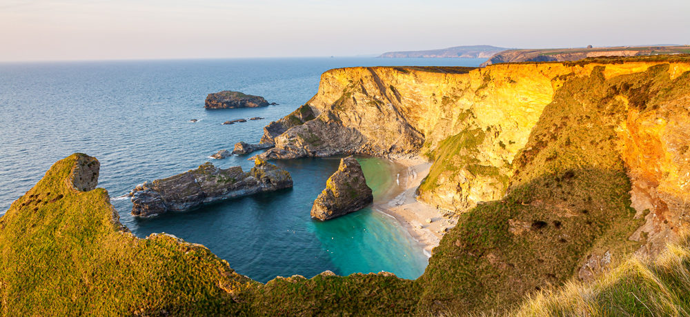 Cornwall's North Cliffs in sunlight, with blue sea