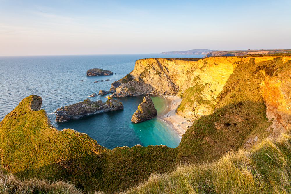 Cornwall's North Cliffs in sunlight, with blue sea