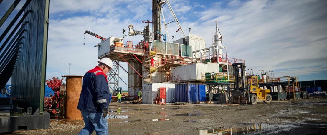 Man walking past Cuadrilla fracking rig