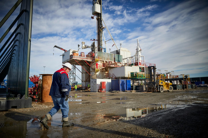 Man walking past Cuadrilla fracking rig