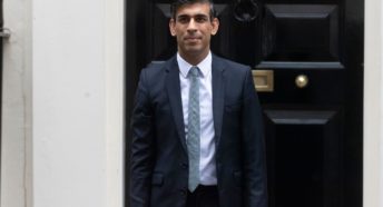 Rishi Sunak stood outside 10 Downing Street