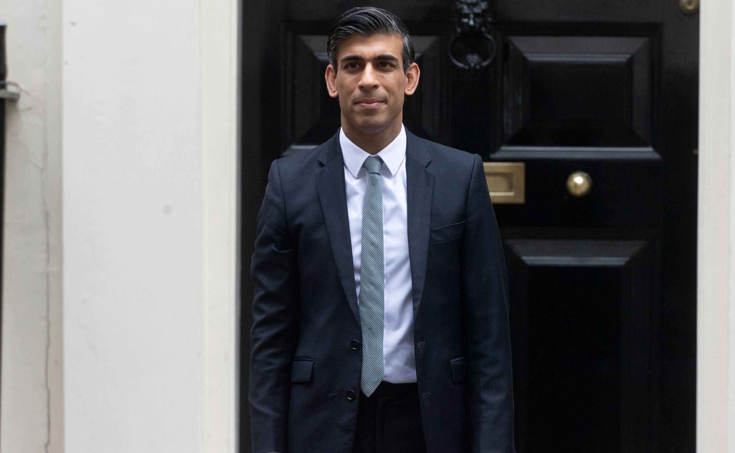 Rishi Sunak stood outside 10 Downing Street