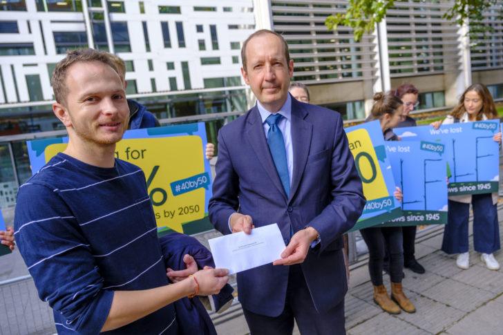 CPRE Campaigns Officer Mark Robinson hands the petition to Defra's Edward Barker