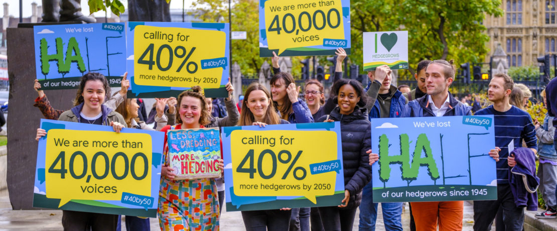 CPRE staff carrying petition boards and walking towards Defra