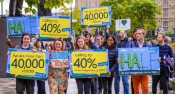 CPRE staff carrying petition boards and walking towards Defra