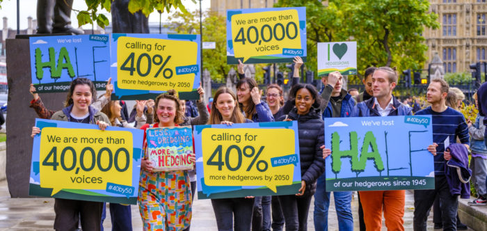 CPRE staff carrying petition boards and walking towards Defra