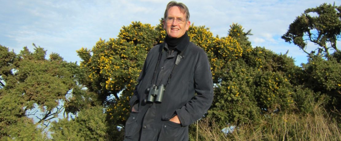 John D. James with gorse bushes in the background.