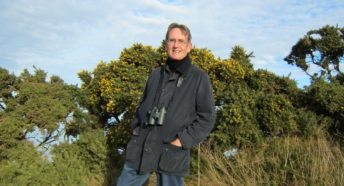 John D. James with gorse bushes in the background.