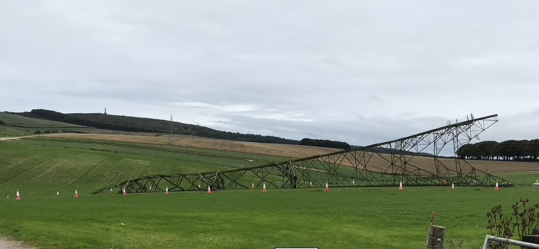 Pylon on its side in a field