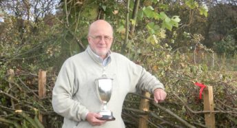 Derrick Hale stood in front of a laid hedge