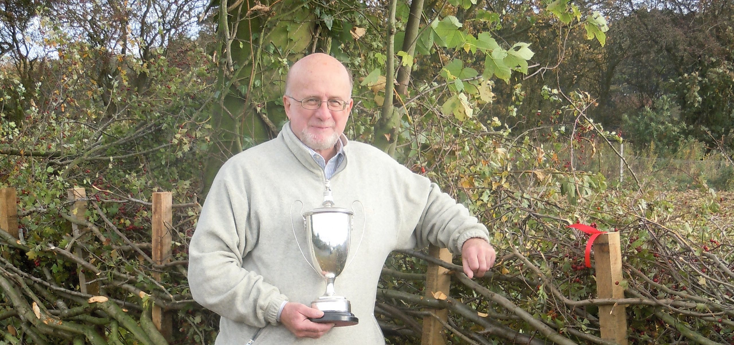 Derrick Hale stood in front of a laid hedge