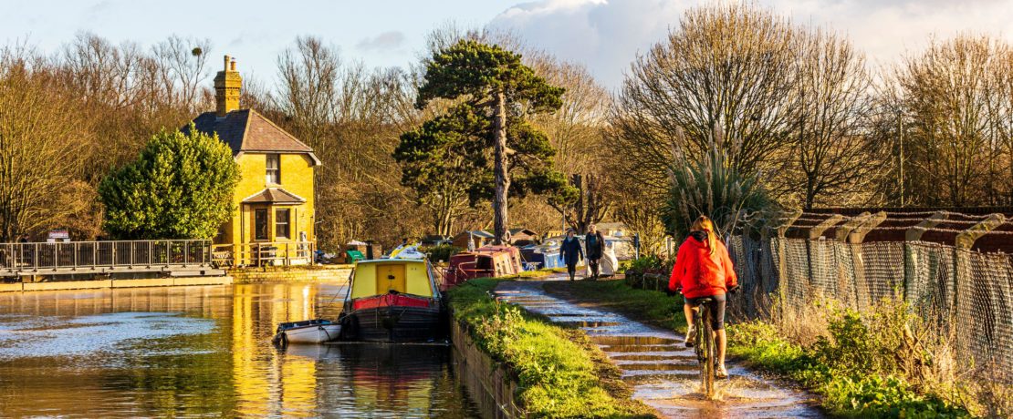 A wintry view of the River Lea with towpath alongside