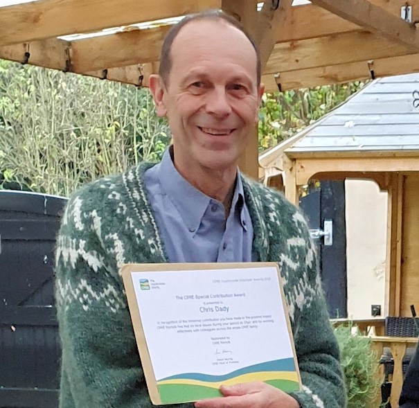 Chris Dady receiving trustee award