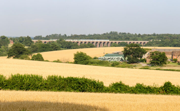 A view over Balcombe, West Sussex, including farmed fields and the Balcombe Viaduct