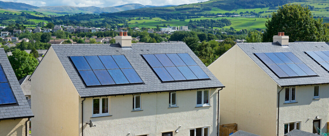 Solar panels on rooftops of new housing in Cumbria