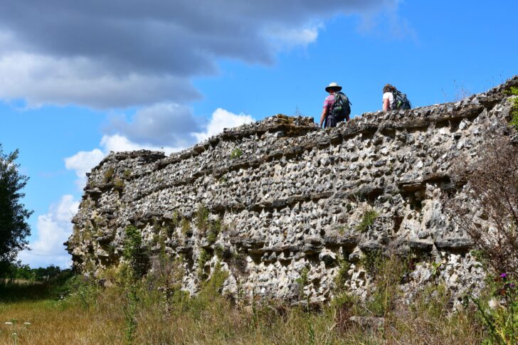 Couple walking along the top of the Silchester Roman City Walls, Silchester
