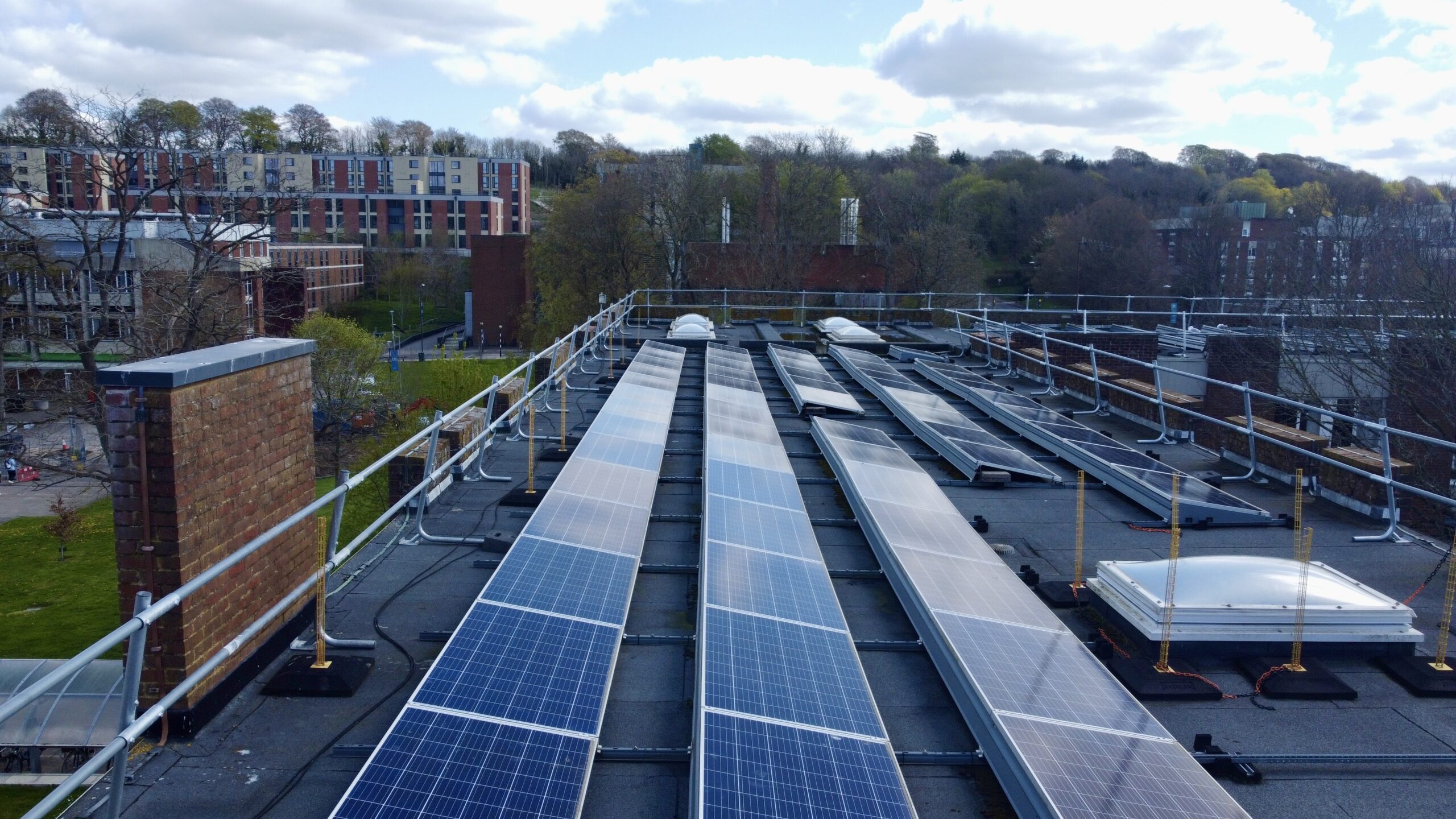 Solar panels along roof of campus building