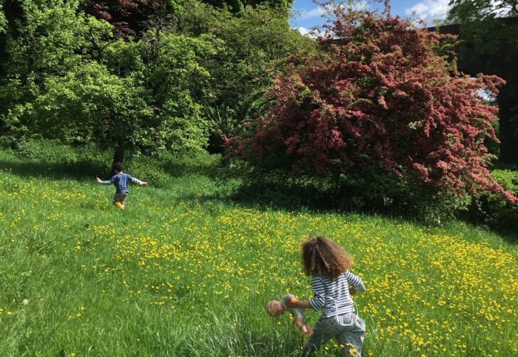 Two children running in the countryside