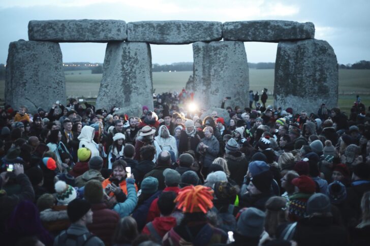 A crowd of people at Stonehenge