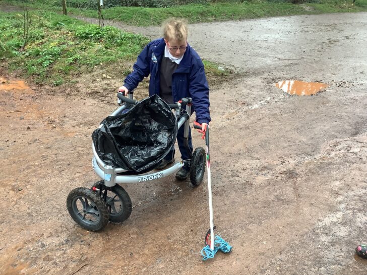 Picking up litter with a walking frame