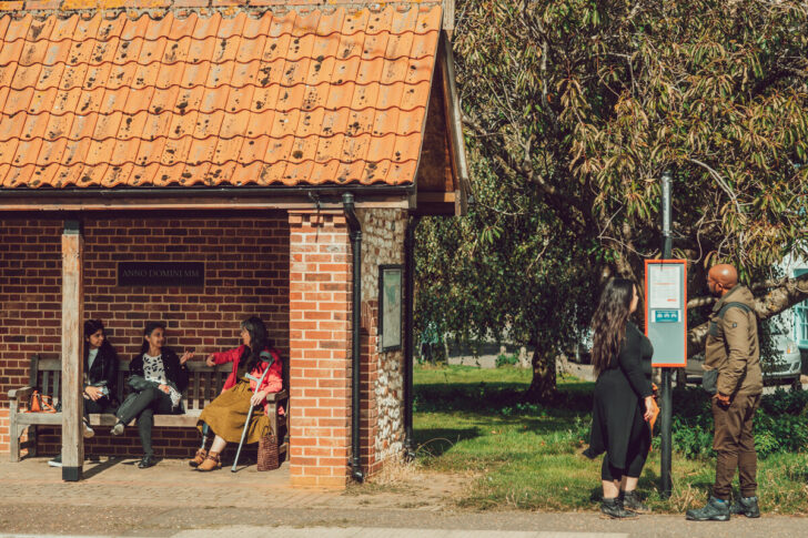 People waiting at a bus stop