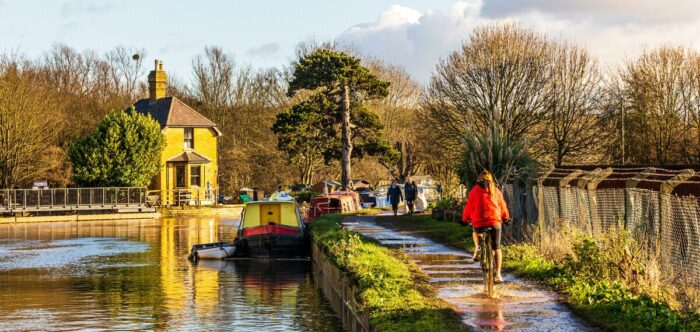 Towpath along the River Lea with moored canal boats