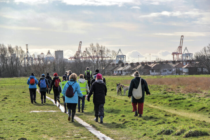 A group of people walking in a field