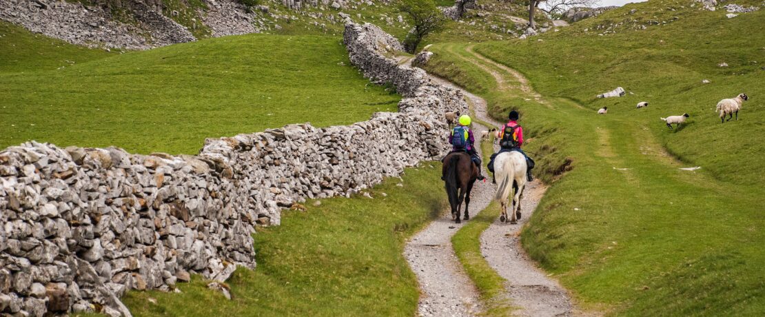 Two riders on the Pennine bridleway above Feizor in North Yorkshire