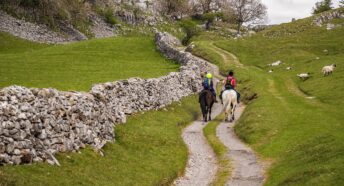 Two riders on the Pennine bridleway above Feizor in North Yorkshire