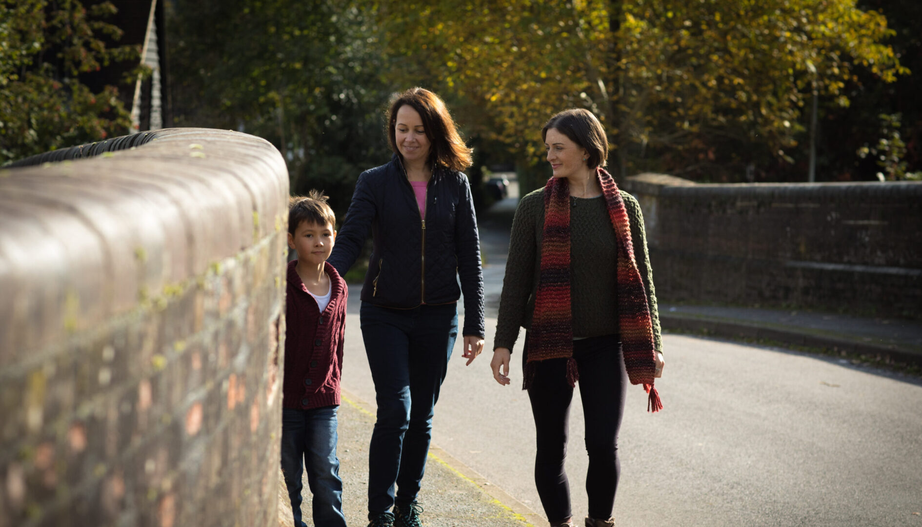 Women and child on road bridge in Surrey Hills AONB