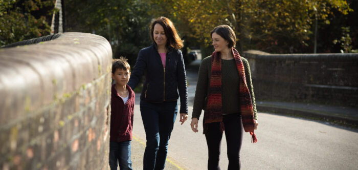 Women and child on road bridge in Surrey Hills AONB