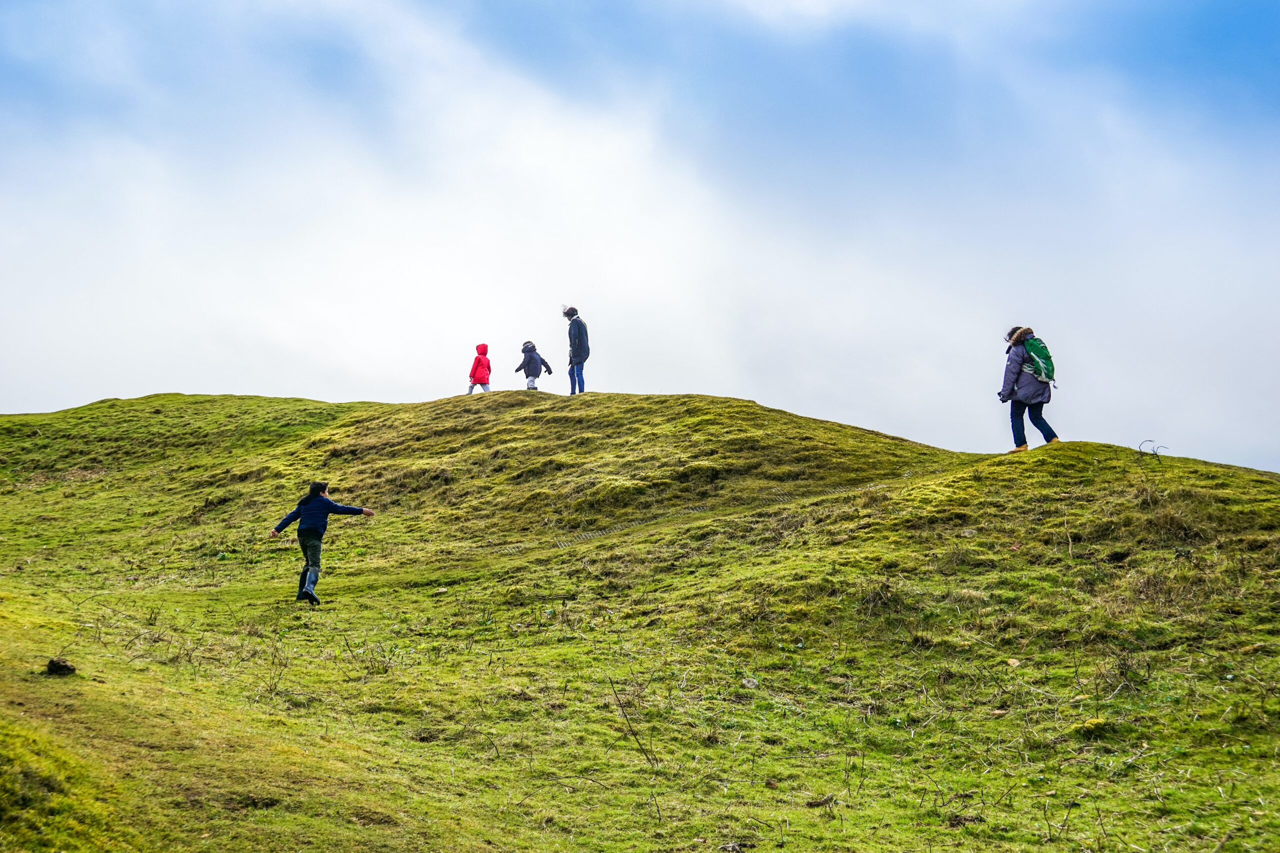 Adults and children hiking in the Cotswolds