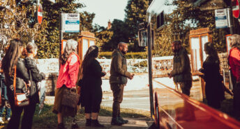 Group of people in a queue to get on a bus