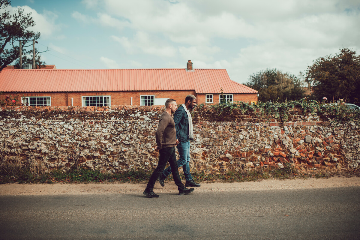 A couple on a walk through a rural village