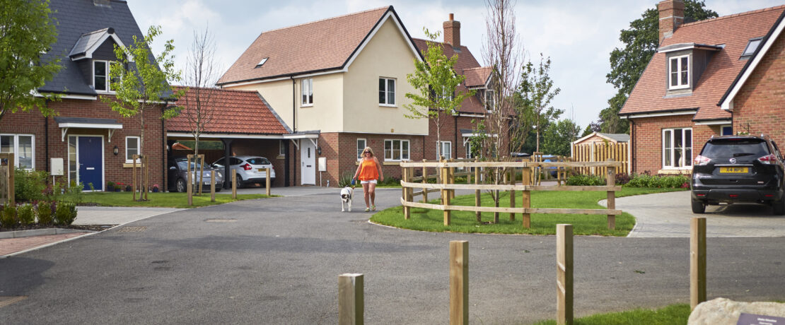 Women walking through an affordable housing site