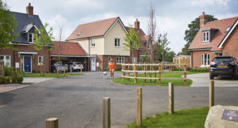 Women walking through an affordable housing site