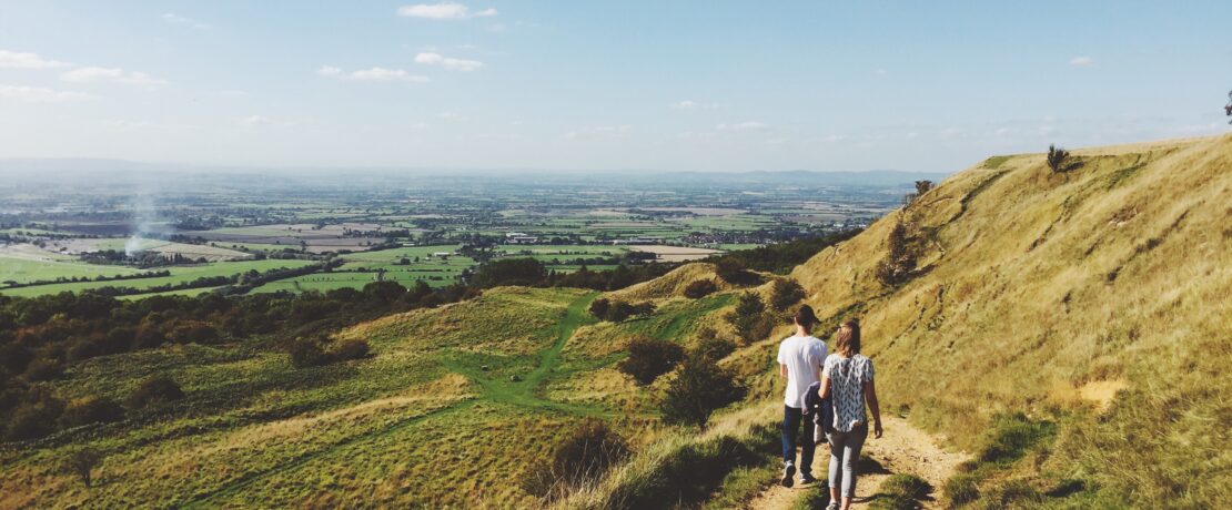 Two poeple walking along the Cotswold Way