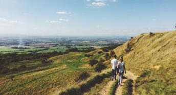 Two poeple walking along the Cotswold Way