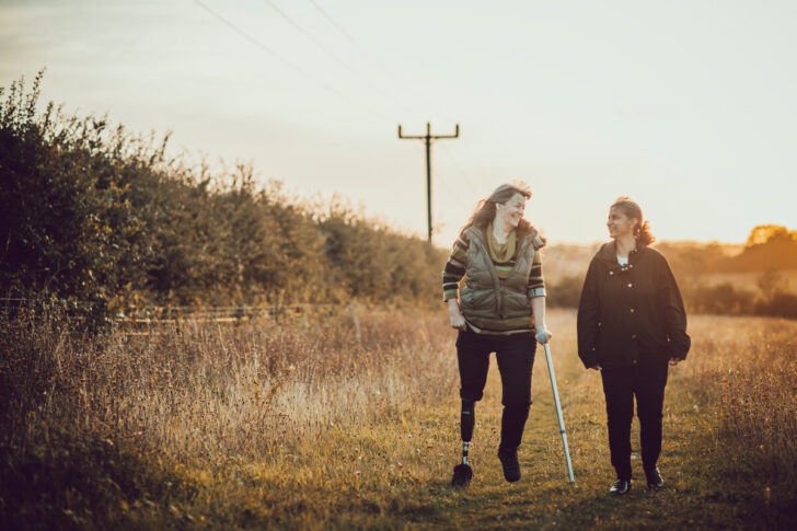 Two people enjoying the countryside near sunset