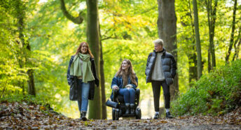 Three people enjoying the woods