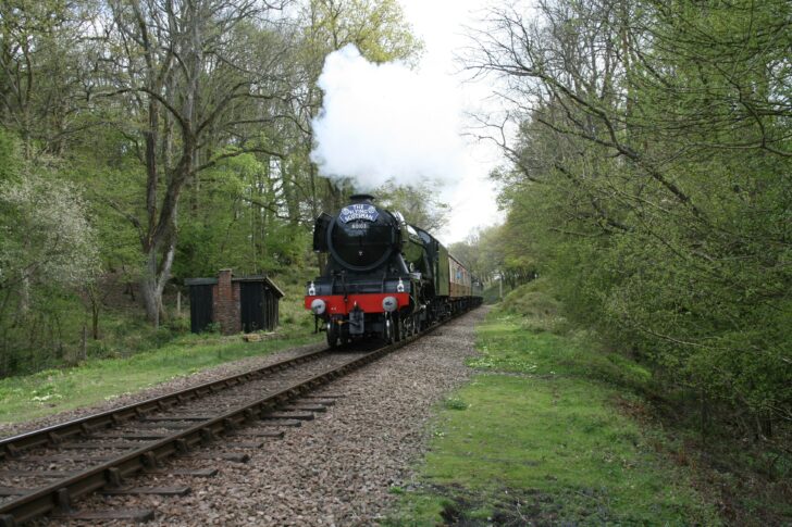 A stream train passing through the countryside