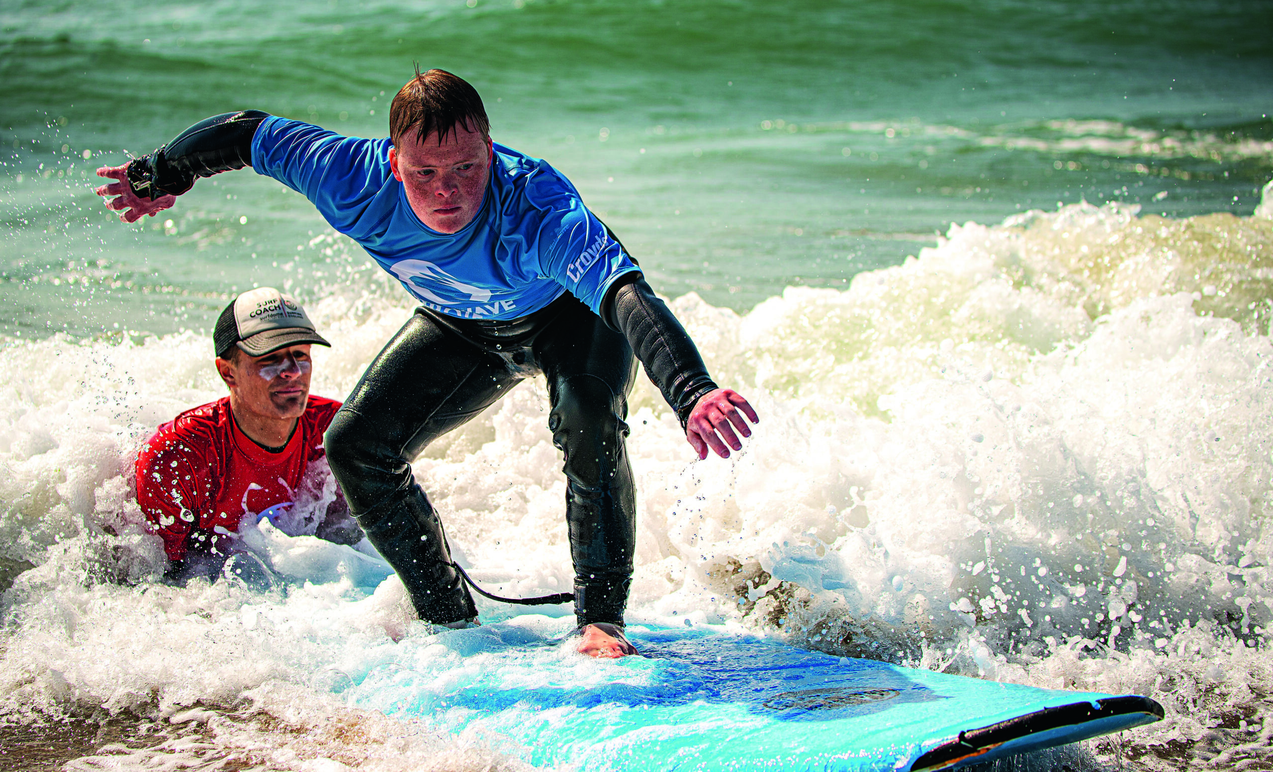 A surfer in action at The Wave Project’s adaptive surfing hub