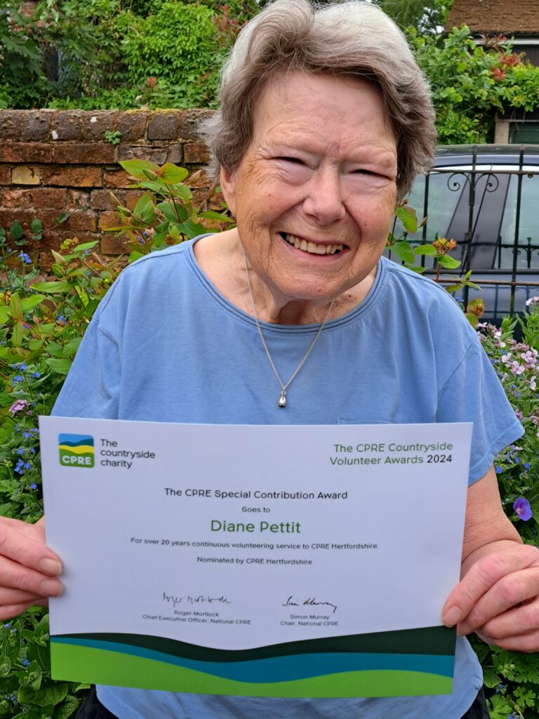 Diane Pettit holding her Special Contribution award