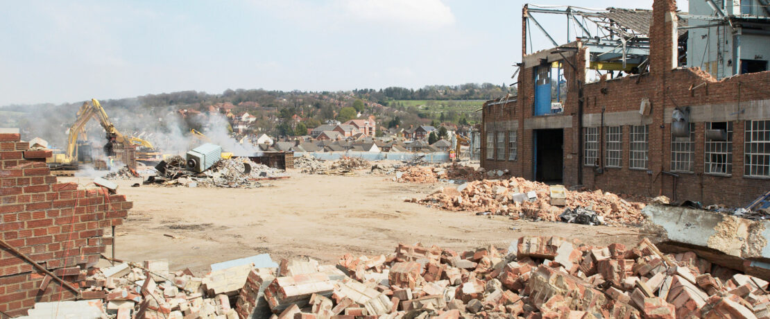 Demolition of a factory and clearing a plot of disused land