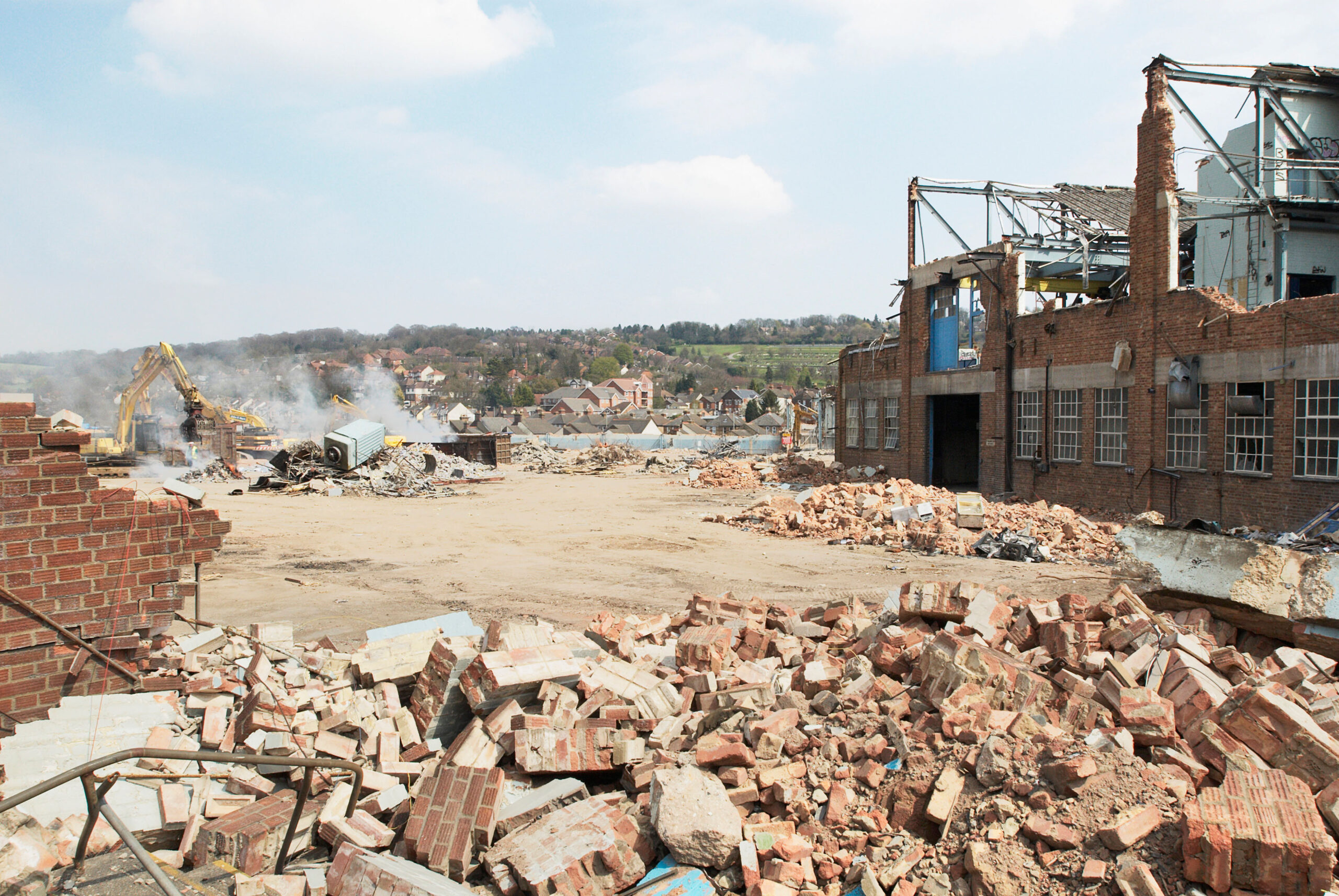 Demolition of a factory and clearing a plot of disused land