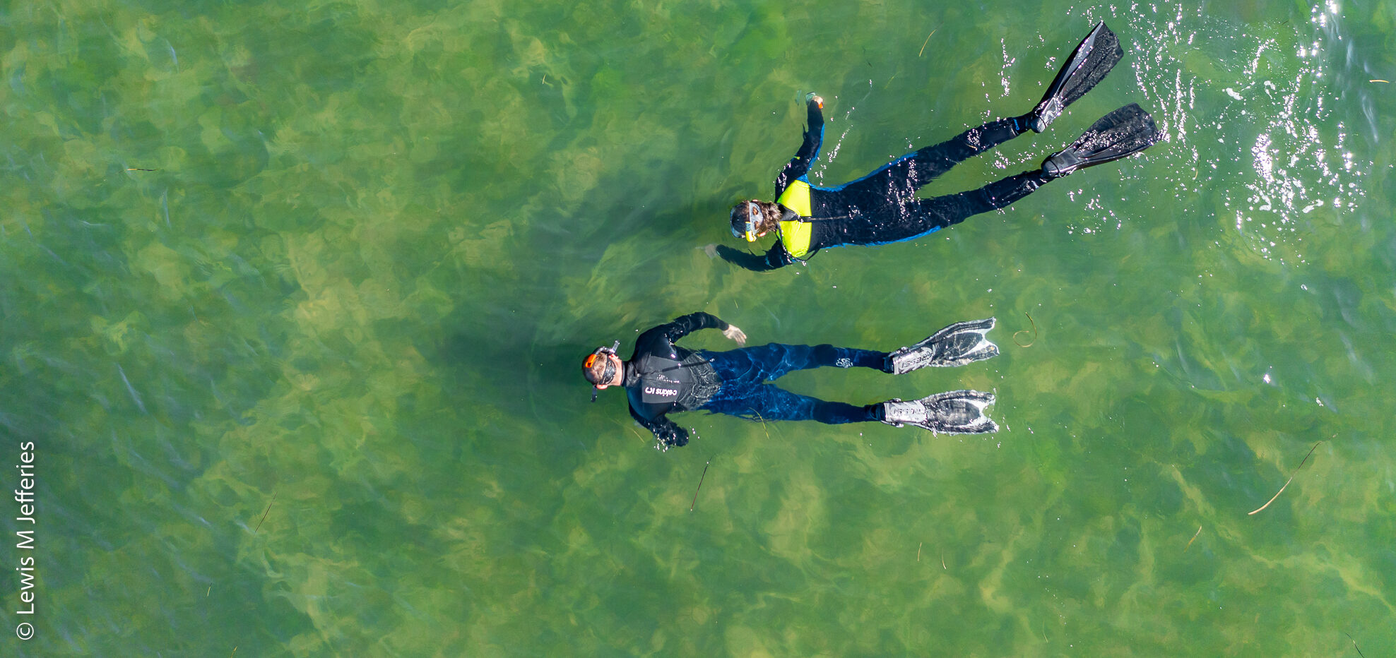 Two people floating in the sea